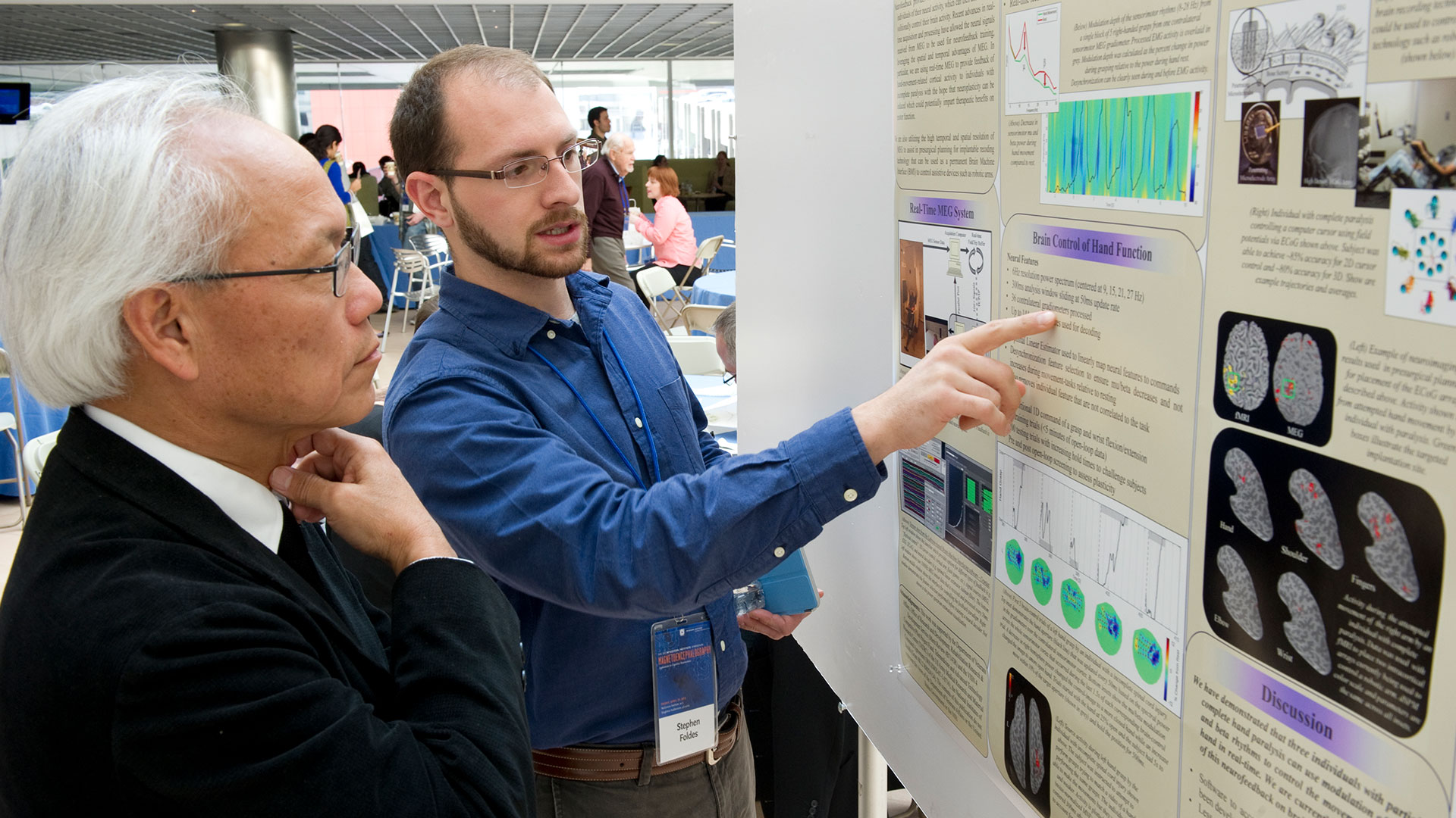 Researcher presents data at poster presentation